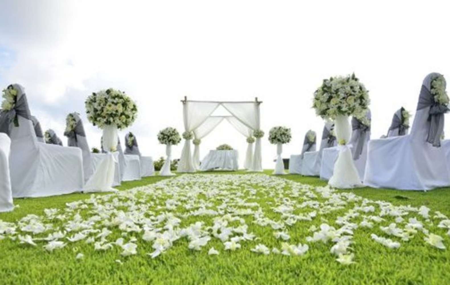 Outdoor wedding floral aisle